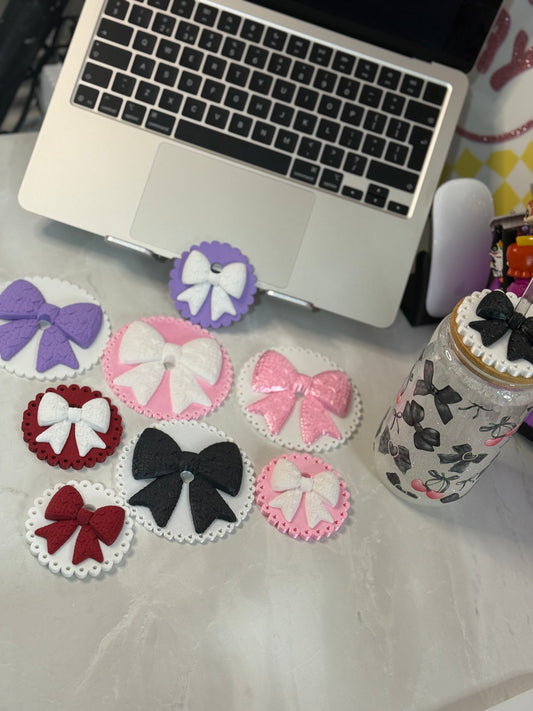 Knitted bow lid toppers